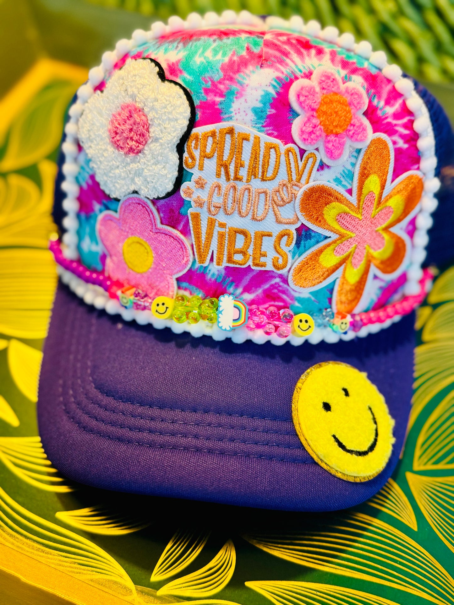 🌈 “Spread Good Vibes” Tie-Dye Trucker Hat – Handmade with Groovy Patches & Smiley Beads 🌼