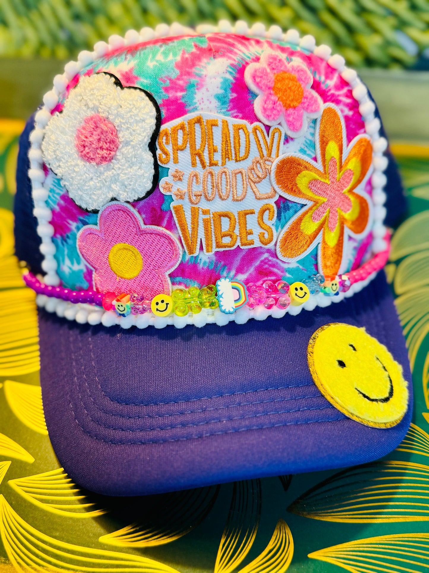 🌈 “Spread Good Vibes” Tie-Dye Trucker Hat – Handmade with Groovy Patches & Smiley Beads 🌼